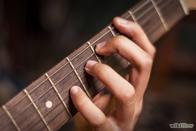 hand on guitar